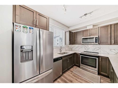 138-301 Redstone Boulevard Ne, Calgary, AB - Indoor Photo Showing Kitchen With Double Sink