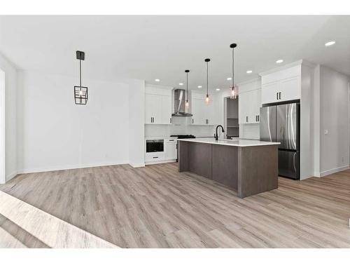 203 Kinniburgh Loop, Chestermere, AB - Indoor Photo Showing Kitchen With Upgraded Kitchen