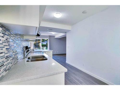 201-1820 9 Street Sw, Calgary, AB - Indoor Photo Showing Kitchen With Double Sink