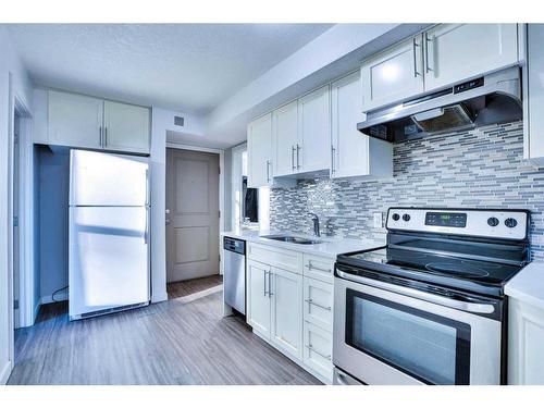 201-1820 9 Street Sw, Calgary, AB - Indoor Photo Showing Kitchen With Stainless Steel Kitchen