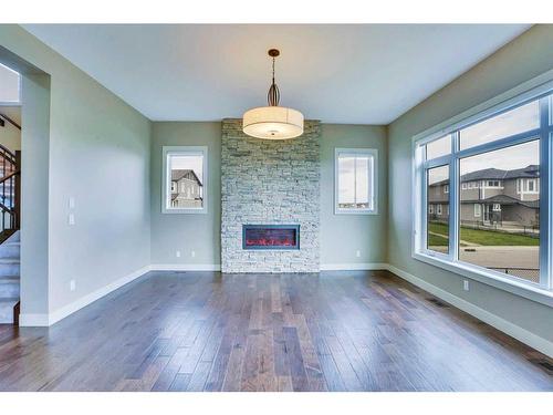 94 Panton View Nw, Calgary, AB - Indoor Photo Showing Living Room With Fireplace