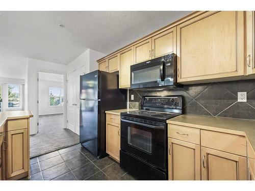 1310-303 Arbour Crest Drive Nw, Calgary, AB - Indoor Photo Showing Kitchen