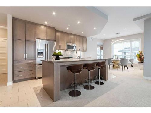 313-145 Burma Star Road Sw, Calgary, AB - Indoor Photo Showing Kitchen With Stainless Steel Kitchen With Upgraded Kitchen