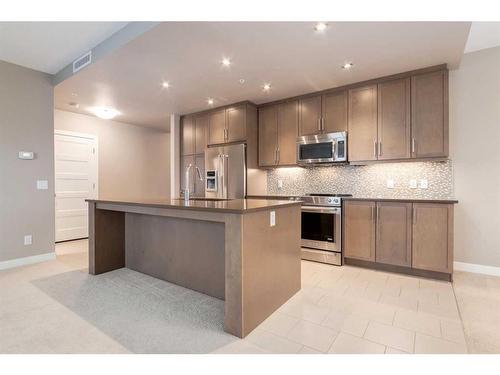 313-145 Burma Star Road Sw, Calgary, AB - Indoor Photo Showing Kitchen With Upgraded Kitchen