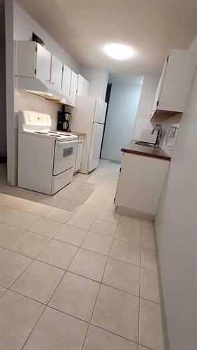 204-1335 12 Avenue Sw, Calgary, AB - Indoor Photo Showing Laundry Room