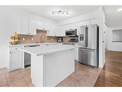 8 Bridleridge Lane Sw, Calgary, AB - Indoor Photo Showing Kitchen With Stainless Steel Kitchen With Upgraded Kitchen