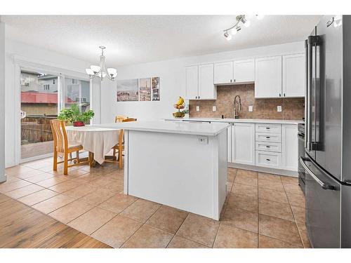 8 Bridleridge Lane Sw, Calgary, AB - Indoor Photo Showing Kitchen With Stainless Steel Kitchen With Upgraded Kitchen