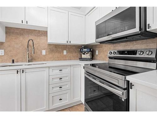 8 Bridleridge Lane Sw, Calgary, AB - Indoor Photo Showing Kitchen With Upgraded Kitchen