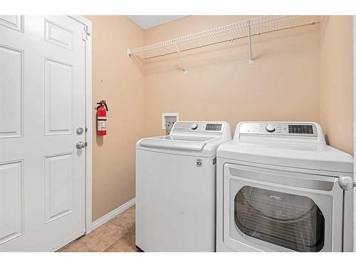 8 Bridleridge Lane Sw, Calgary, AB - Indoor Photo Showing Laundry Room