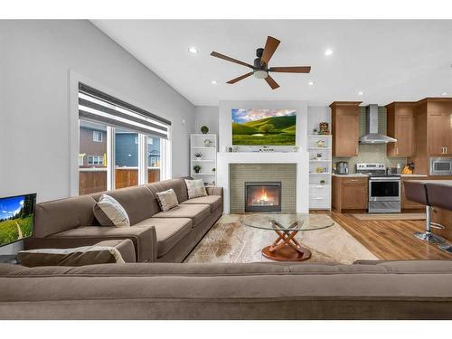 89 Saddlestone Place Ne, Calgary, AB - Indoor Photo Showing Living Room With Fireplace