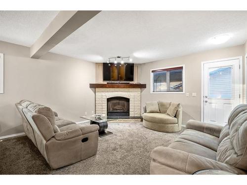 60 Riverbirch Court Se, Calgary, AB - Indoor Photo Showing Living Room With Fireplace