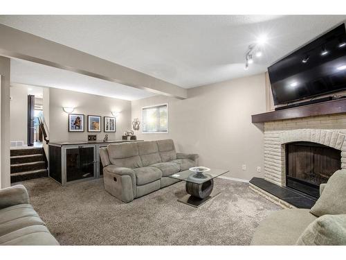 60 Riverbirch Court Se, Calgary, AB - Indoor Photo Showing Living Room With Fireplace