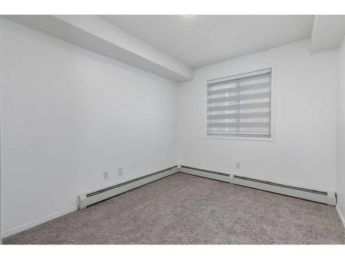 119-7210 80 Avenue Ne, Calgary, AB - Indoor Photo Showing Other Room