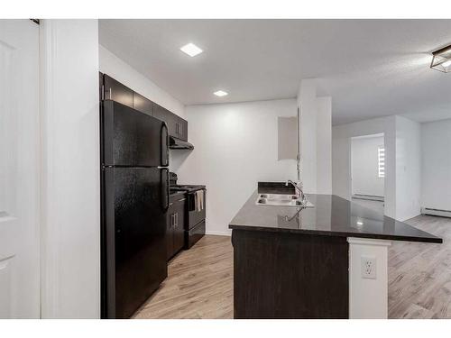 119-7210 80 Avenue Ne, Calgary, AB - Indoor Photo Showing Kitchen With Double Sink