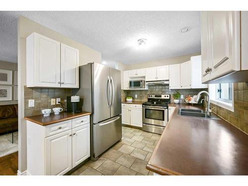 2-2211 28 Street Sw, Calgary, AB - Indoor Photo Showing Kitchen With Double Sink