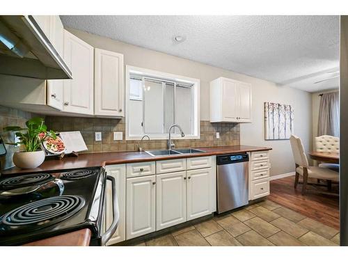 2-2211 28 Street Sw, Calgary, AB - Indoor Photo Showing Kitchen With Double Sink