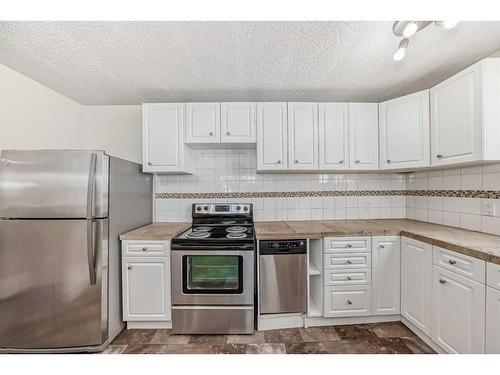 401-1817 11 Avenue Sw, Calgary, AB - Indoor Photo Showing Kitchen With Stainless Steel Kitchen