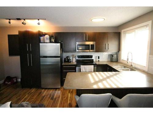 301-1810 16 Street Sw, Calgary, AB - Indoor Photo Showing Kitchen With Double Sink