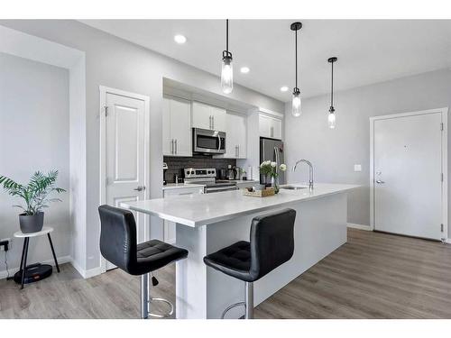 418-4150 Seton Drive Se, Calgary, AB - Indoor Photo Showing Kitchen With Upgraded Kitchen