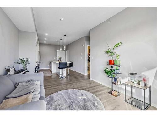 418-4150 Seton Drive Se, Calgary, AB - Indoor Photo Showing Living Room