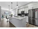 418-4150 Seton Drive Se, Calgary, AB  - Indoor Photo Showing Kitchen With Stainless Steel Kitchen With Double Sink With Upgraded Kitchen 