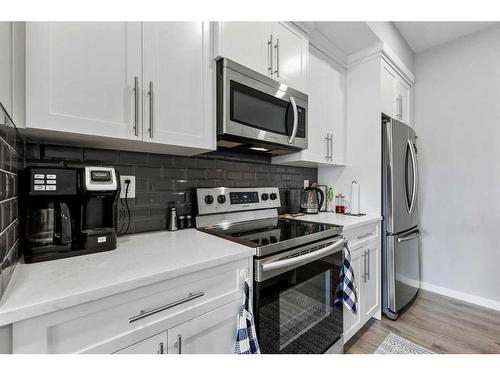 418-4150 Seton Drive Se, Calgary, AB - Indoor Photo Showing Kitchen With Stainless Steel Kitchen