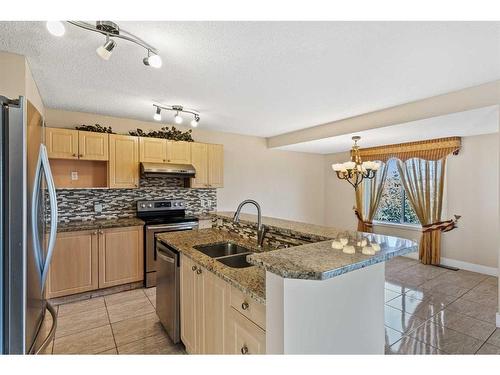 84 Taracove Crescent Ne, Calgary, AB - Indoor Photo Showing Kitchen With Double Sink With Upgraded Kitchen