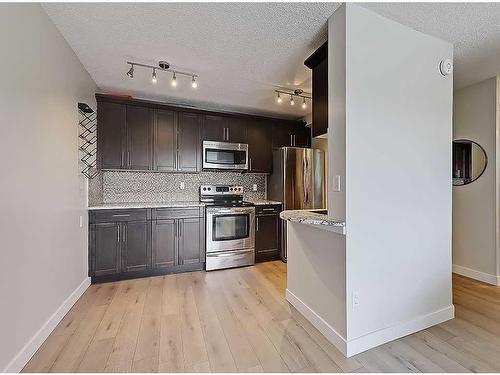 801-1330 15 Avenue Sw, Calgary, AB - Indoor Photo Showing Kitchen With Stainless Steel Kitchen