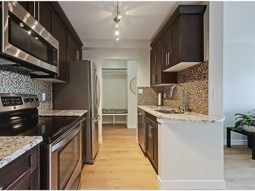 801-1330 15 Avenue Sw, Calgary, AB - Indoor Photo Showing Kitchen With Stainless Steel Kitchen With Upgraded Kitchen