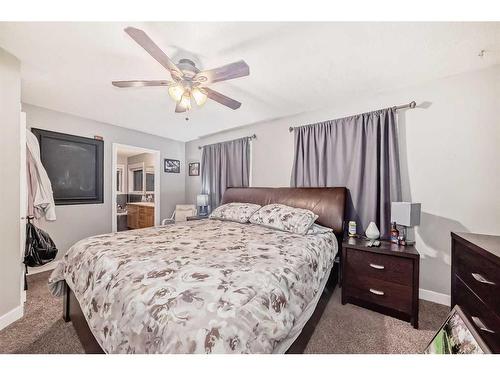 25 Cimarron Crescent, Okotoks, AB - Indoor Photo Showing Bedroom