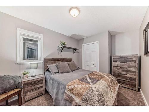 25 Cimarron Crescent, Okotoks, AB - Indoor Photo Showing Bedroom