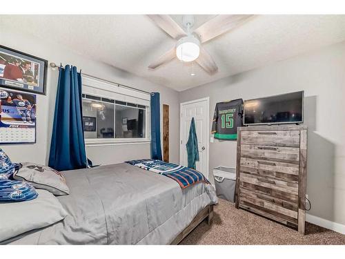 25 Cimarron Crescent, Okotoks, AB - Indoor Photo Showing Bedroom