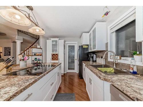 25 Cimarron Crescent, Okotoks, AB - Indoor Photo Showing Kitchen With Double Sink