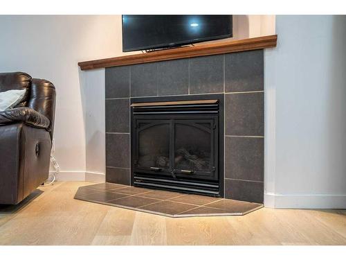 2308 Munro Drive Ne, Calgary, AB - Indoor Photo Showing Living Room With Fireplace