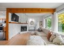 2308 Munro Drive Ne, Calgary, AB  - Indoor Photo Showing Living Room With Fireplace 