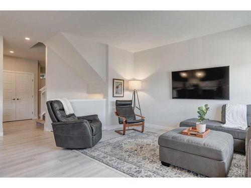 218 Riviera View, Cochrane, AB - Indoor Photo Showing Living Room