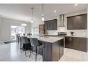 218 Riviera View, Cochrane, AB  - Indoor Photo Showing Kitchen With Stainless Steel Kitchen With Upgraded Kitchen 