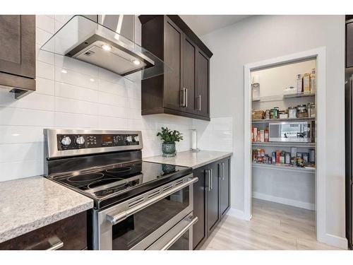 218 Riviera View, Cochrane, AB - Indoor Photo Showing Kitchen With Stainless Steel Kitchen