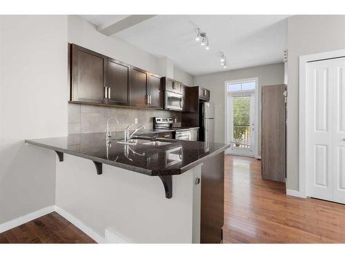 144 New Brighton Point Se, Calgary, AB - Indoor Photo Showing Kitchen With Upgraded Kitchen