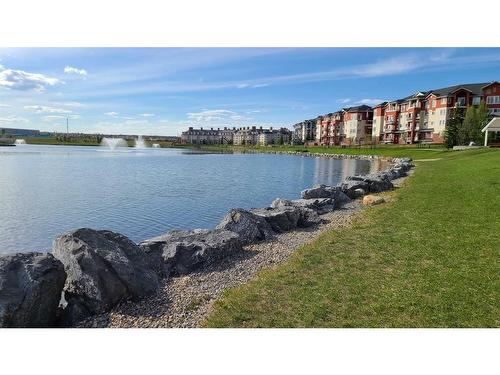 207-9 Country Village Bay Ne, Calgary, AB - Outdoor With Body Of Water With View