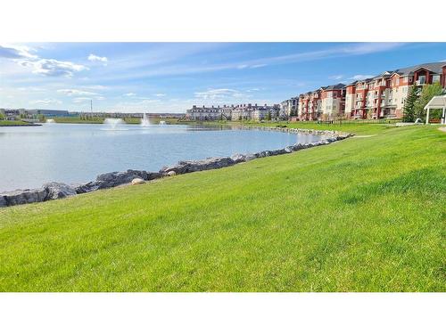 207-9 Country Village Bay Ne, Calgary, AB - Outdoor With Body Of Water With View