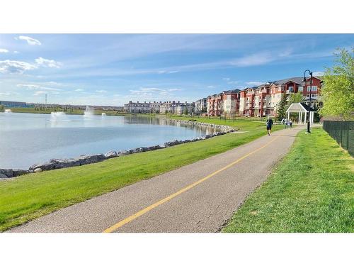 207-9 Country Village Bay Ne, Calgary, AB - Outdoor With Body Of Water With View