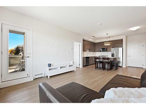 401-30 Shawnee Common Sw, Calgary, AB - Indoor Photo Showing Living Room