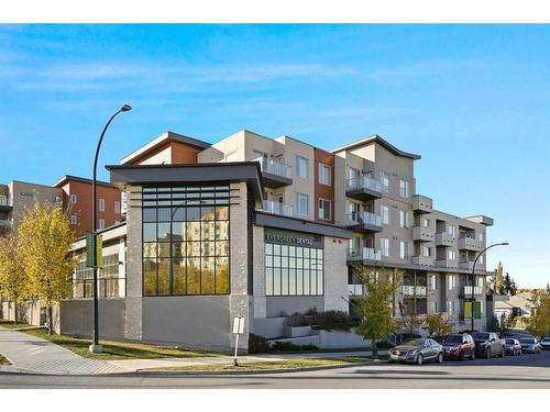 401-30 Shawnee Common Sw, Calgary, AB - Outdoor With Balcony With Facade