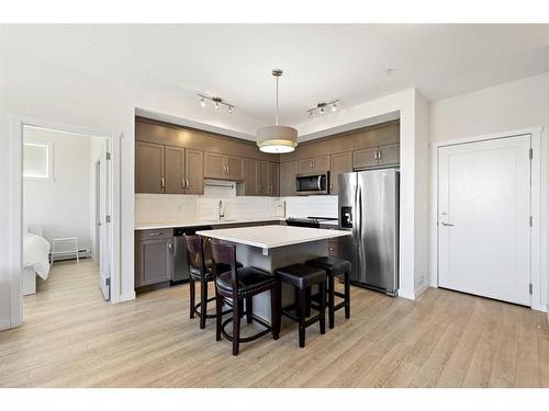 401-30 Shawnee Common Sw, Calgary, AB - Indoor Photo Showing Kitchen With Stainless Steel Kitchen With Upgraded Kitchen