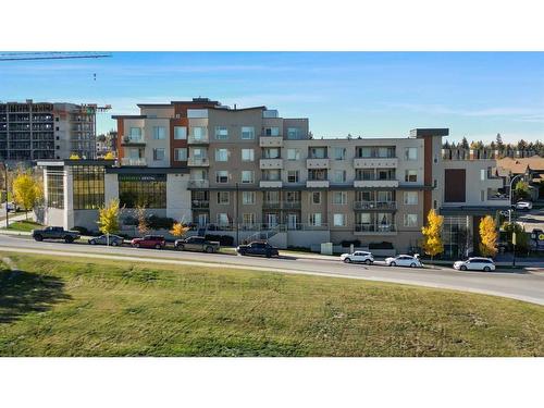 401-30 Shawnee Common Sw, Calgary, AB - Outdoor With Balcony With Facade