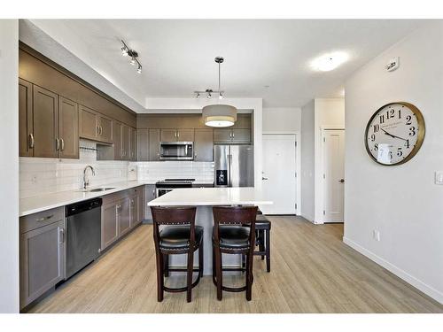 401-30 Shawnee Common Sw, Calgary, AB - Indoor Photo Showing Kitchen With Stainless Steel Kitchen With Upgraded Kitchen