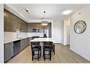 401-30 Shawnee Common Sw, Calgary, AB  - Indoor Photo Showing Kitchen With Stainless Steel Kitchen With Upgraded Kitchen 