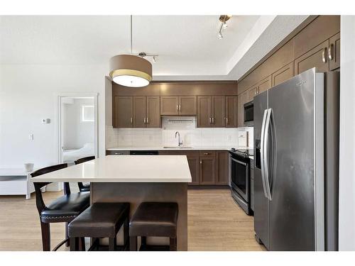 401-30 Shawnee Common Sw, Calgary, AB - Indoor Photo Showing Kitchen With Stainless Steel Kitchen With Upgraded Kitchen