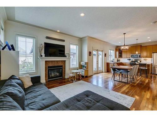 3-2326 2 Avenue Nw, Calgary, AB - Indoor Photo Showing Living Room With Fireplace